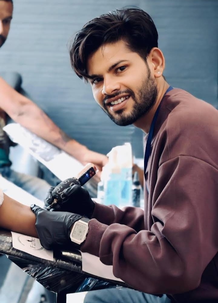 DMR Tattoo Studio artist at work — professional tattoo session in Diu, India