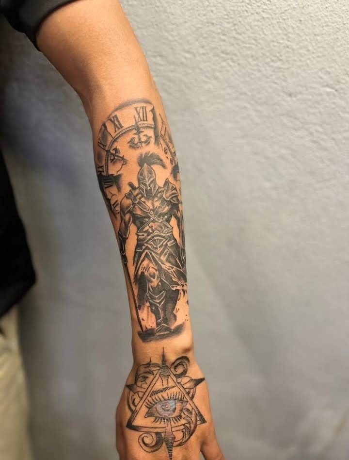 Warrior with clock forearm sleeve tattoo by DMR Tattoo Studio Diu